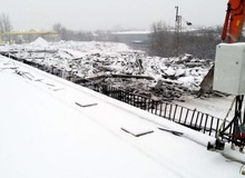 В Ростове, несмотря на плохую погоду, продолжается реконструкция моста через железнодорожные пути по улице Малиновского.